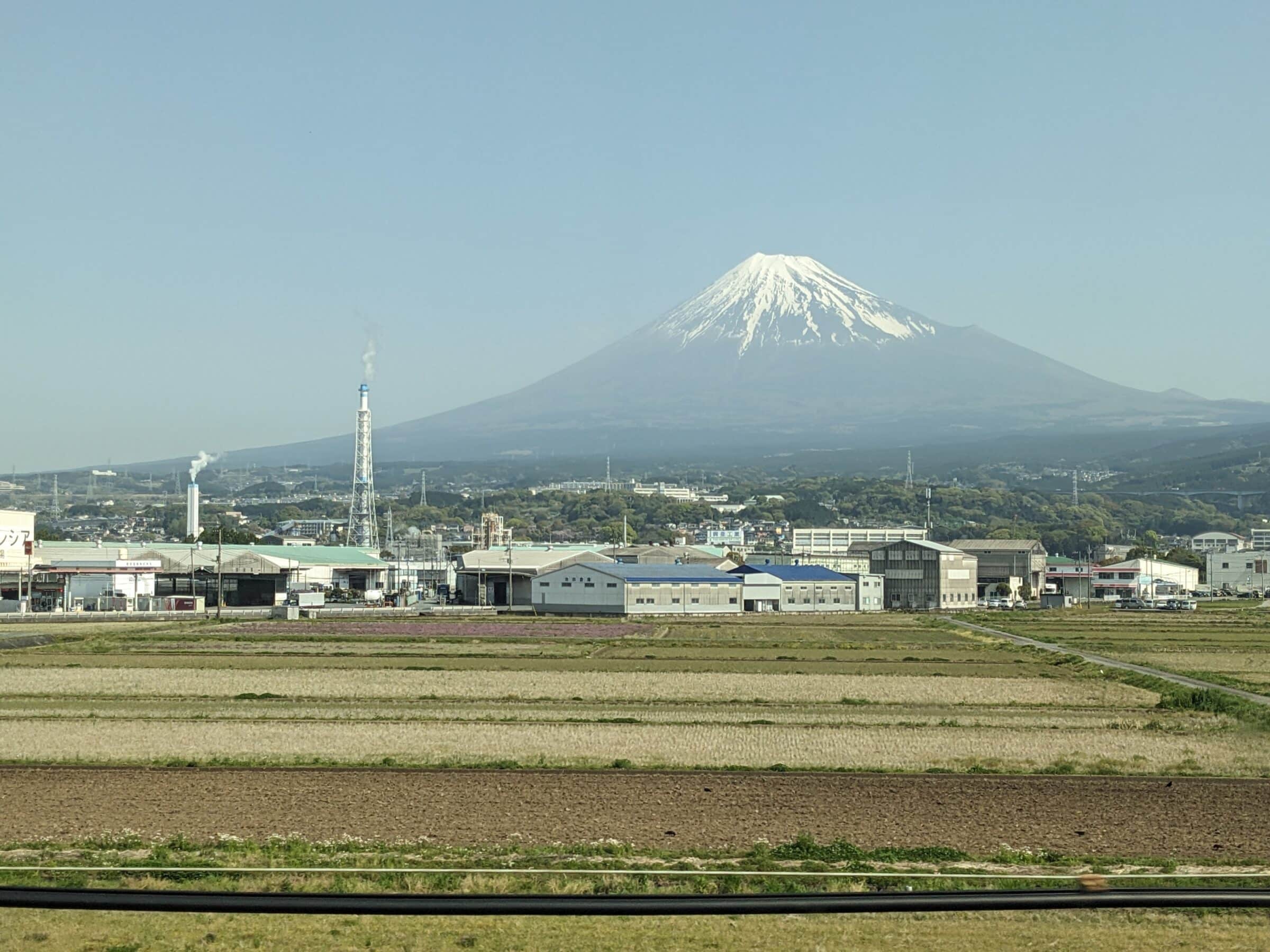 city with volcano in background