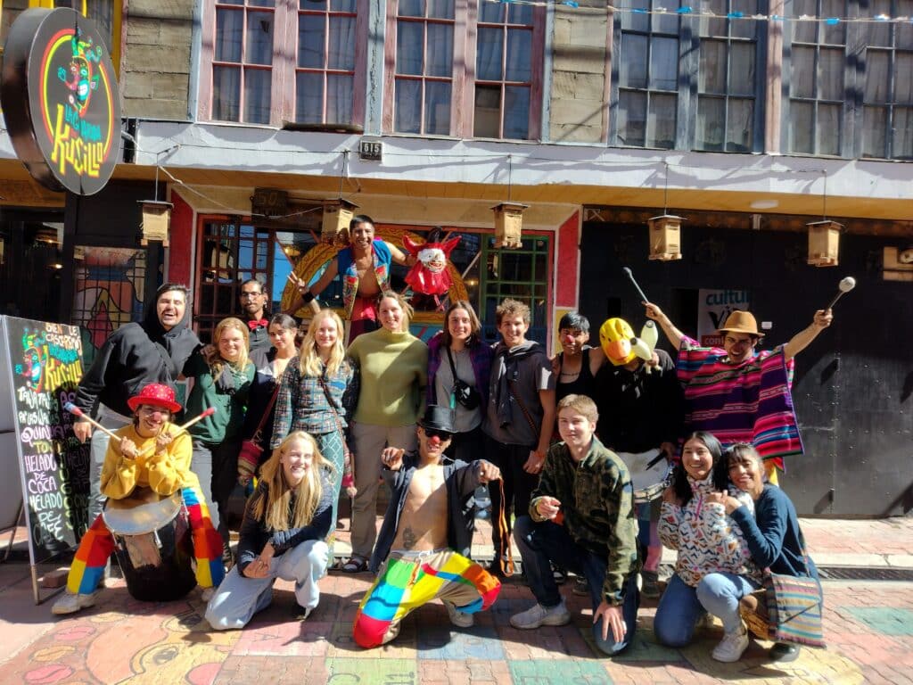group out front of of a building in the street