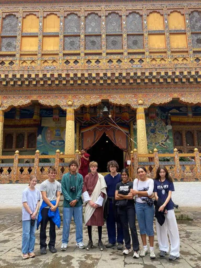 group in front of ornately decorated building