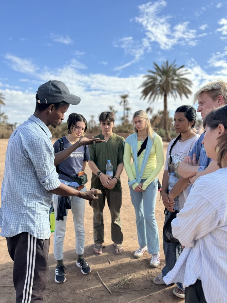 group listening to person teaching