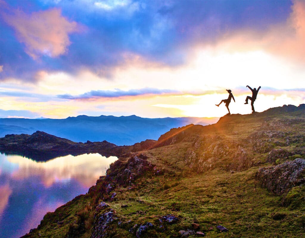 sillhouette people dancing on mountain