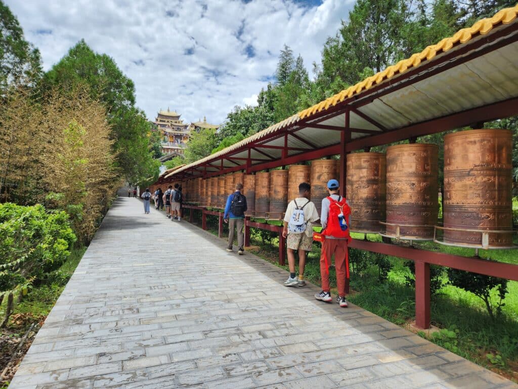 people spinning prayer wheels