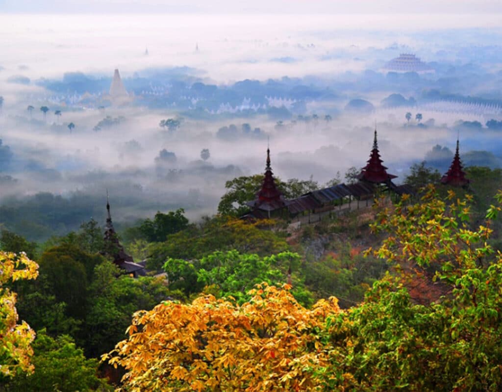 temple tops peaking through clouds