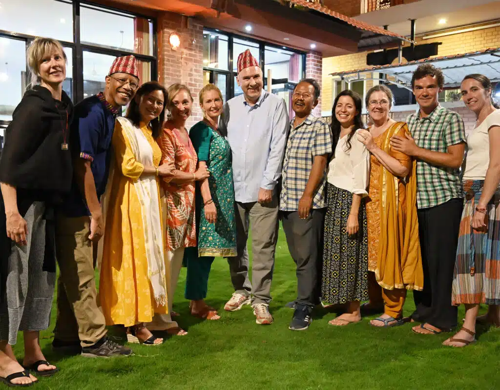 group posing in front of building