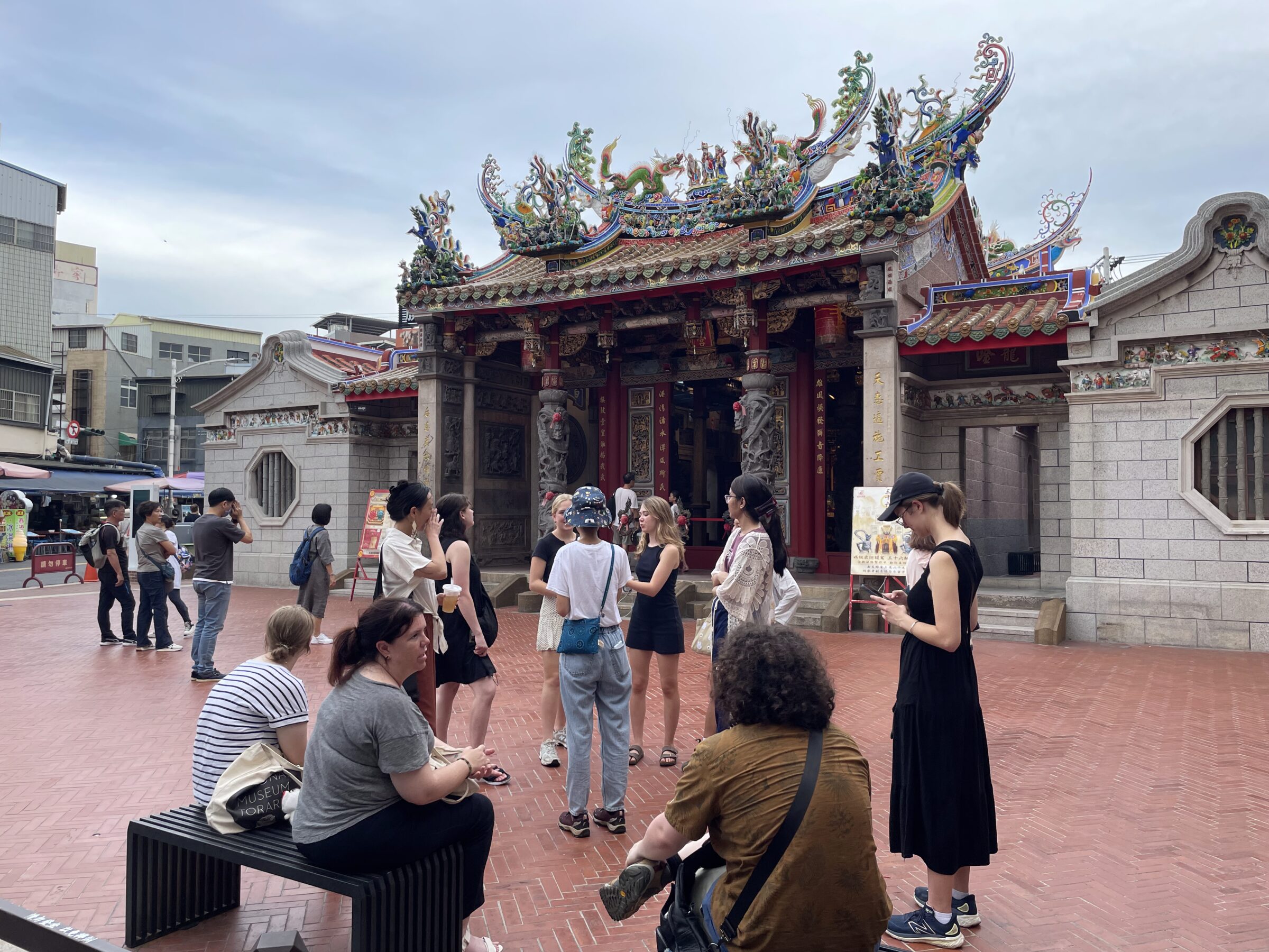 group standing in courtyard by ornate building