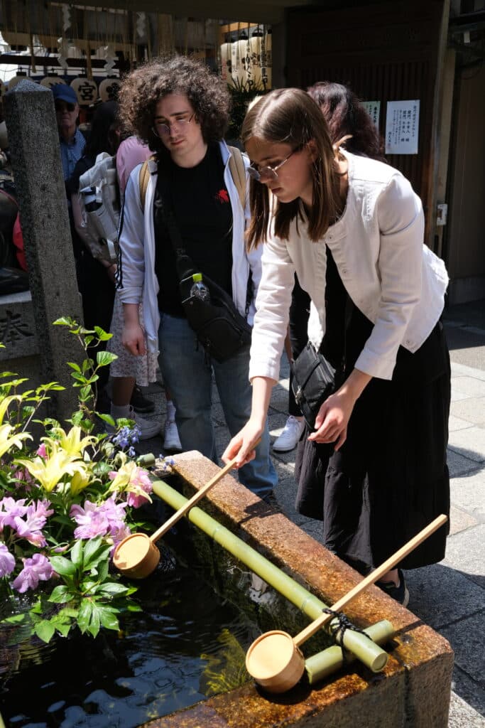 person scooping water