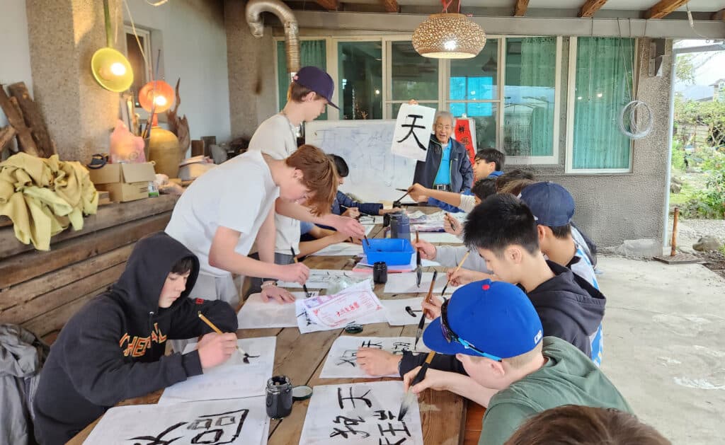 students practicing calligraphy