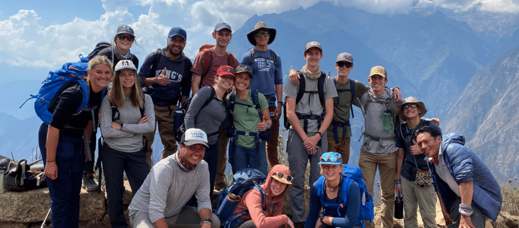 group smiling in mountains