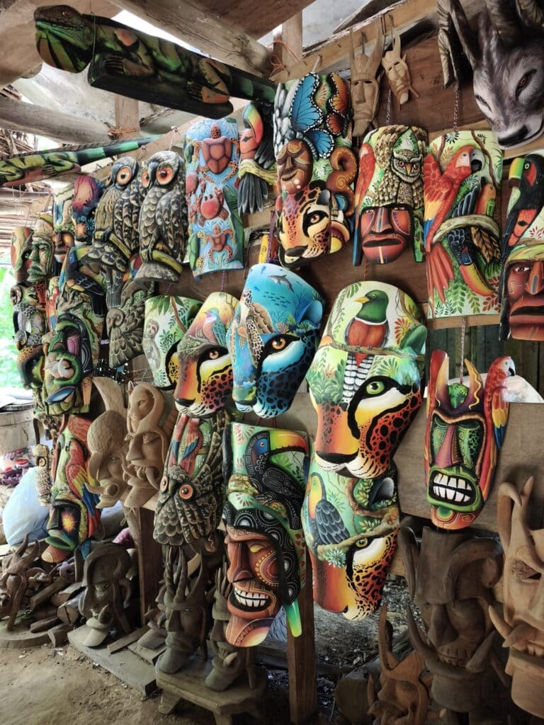 bright wooden masks hanging on wall