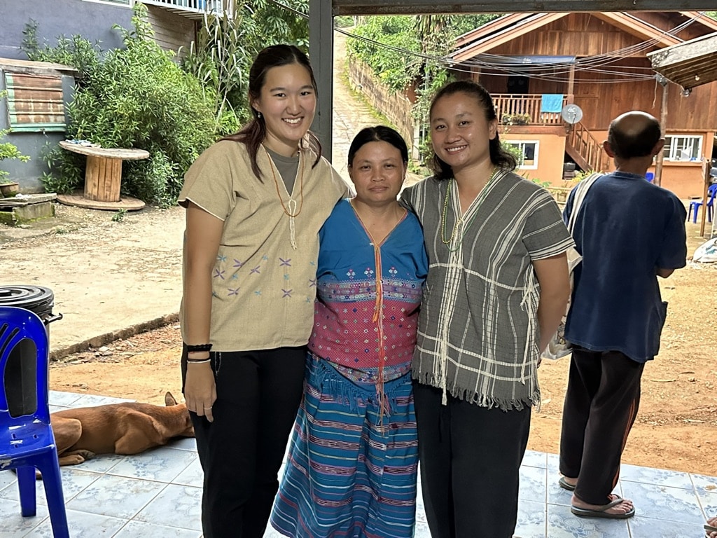 people smiling for camera in small village