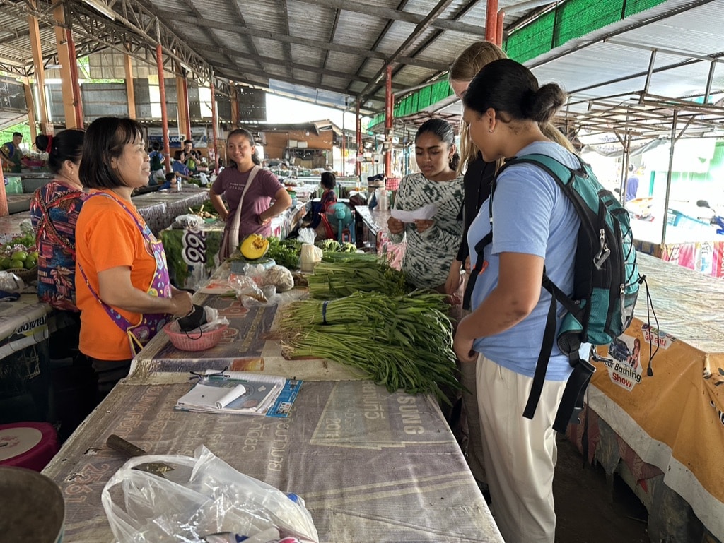 buying vegetables at market